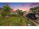 Charming single-story home with a lush green lawn and mature landscaping, offering great curb appeal at 5643 86Th N Ave, Pinellas Park, FL 33782