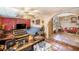 Spacious living area with textured walls, a large television, and comfortable seating for relaxation and entertainment at 5643 86Th N Ave, Pinellas Park, FL 33782