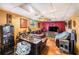 Spacious living area with textured walls, a large television, and comfortable seating for relaxation and entertainment at 5643 86Th N Ave, Pinellas Park, FL 33782