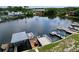 Aerial view of waterfront docks, showcasing outdoor living space and providing a serene view of the water at 599 Westwinds Dr # 9, Palm Harbor, FL 34683