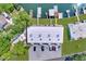 Aerial view of the property showing parking, docks, and serene waterfront access, with mature trees providing privacy at 599 Westwinds Dr # 9, Palm Harbor, FL 34683