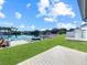 Serene backyard with a deck overlooking the beautiful waterfront, showcasing seamless access to water activities at 599 Westwinds Dr # 9, Palm Harbor, FL 34683