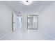 Bedroom featuring tile flooring and a closet with mirrored doors at 599 Westwinds Dr # 9, Palm Harbor, FL 34683
