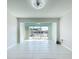 Spacious living room with tile flooring and sliding glass doors to the outside at 599 Westwinds Dr # 9, Palm Harbor, FL 34683
