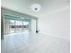Bright, open living area with large sliding doors offers scenic waterfront views and access at 599 Westwinds Dr # 9, Palm Harbor, FL 34683