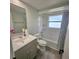 Bathroom with a shower/tub combination and a grey vanity at 6008 Firefly Ln, Apollo Beach, FL 33572