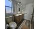 Updated bathroom with double sink vanity and mosaic tile accents at 6008 Firefly Ln, Apollo Beach, FL 33572