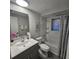 Bathroom with a shower/tub combination and a grey vanity at 6008 Firefly Ln, Apollo Beach, FL 33572