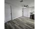 The dining area features a ceiling fan, hardwood floors and natural light at 6008 Firefly Ln, Apollo Beach, FL 33572