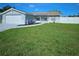 Charming single-story home featuring well-manicured lawn and front yard landscaping at 6008 Firefly Ln, Apollo Beach, FL 33572