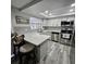 Modern kitchen with stainless steel appliances, sleek countertops, and stylish backsplash at 6008 Firefly Ln, Apollo Beach, FL 33572