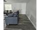 Comfortable living room with modern sofas, stylish floors, and ample natural light at 6008 Firefly Ln, Apollo Beach, FL 33572