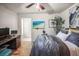 Comfortable bedroom featuring hardwood floors and bright lighting at 630 Mac Crillus Rd, Largo, FL 33770