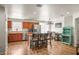 Well-lit kitchen with a central island and cherry cabinets, offering plenty of space and functionality at 630 Mac Crillus Rd, Largo, FL 33770