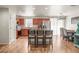 Bright, open kitchen with cherry cabinets, modern appliances, and bar stool seating, ready for cooking at 630 Mac Crillus Rd, Largo, FL 33770