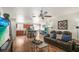 Open living area with wood floors adjoining a modern kitchen and dining area, bright with natural light at 630 Mac Crillus Rd, Largo, FL 33770