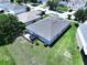 Aerial view of the backyard with a small deck, green space and a patio set at 6314 Gondola Dr, Riverview, FL 33578
