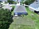 Aerial view of the backyard with a deck, green space, and patio set at 6314 Gondola Dr, Riverview, FL 33578