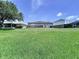 Large grassy backyard, enclosed with a wooden fence, offering ample space and privacy at 6314 Gondola Dr, Riverview, FL 33578