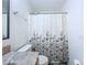 Bathroom showcasing a toilet and shower with a decorative floral shower curtain and updated vanity at 6314 Gondola Dr, Riverview, FL 33578