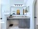 Bathroom featuring vanity, makeup counter and arched doorway to walk-in closet at 6314 Gondola Dr, Riverview, FL 33578