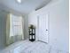 Bright bedroom with marble tile flooring, ample natural light, and a neutral color palette at 6314 Gondola Dr, Riverview, FL 33578