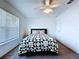 Bright bedroom with ceiling fan and window with blinds for adjustable natural light at 6314 Gondola Dr, Riverview, FL 33578