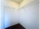 Empty walk-in closet featuring white walls and wire shelving for organized storage at 6314 Gondola Dr, Riverview, FL 33578