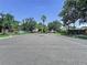 Welcome to Villages of Lake St. Charles with lush landscaping and community signage at 6314 Gondola Dr, Riverview, FL 33578