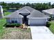 Aerial view of a well-maintained home with a two-car garage and a pristine yard at 6314 Gondola Dr, Riverview, FL 33578