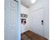 Bright foyer with a white front door and a practical coat rack at 6314 Gondola Dr, Riverview, FL 33578