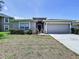 One-story home featuring an attached garage, well-kept lawn, and inviting front entrance at 6314 Gondola Dr, Riverview, FL 33578