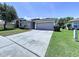 Lovely one-story home with a spacious driveway, attached garage, and well-maintained front yard at 6314 Gondola Dr, Riverview, FL 33578
