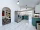 Bright kitchen with modern appliances and tile floors adjacent to the dining and living area at 6314 Gondola Dr, Riverview, FL 33578
