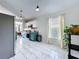 Modern kitchen with stainless steel appliances, white cabinets, and teal lower cabinets at 6314 Gondola Dr, Riverview, FL 33578