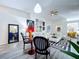 Bright living room featuring a white sectional, modern decor, and stylish black and white striped chairs at 6314 Gondola Dr, Riverview, FL 33578