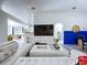 Inviting living room featuring a white sectional sofa, open layout, and stylish decor at 6314 Gondola Dr, Riverview, FL 33578