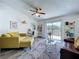 Bright living room featuring a brown sofa, sliding glass doors to a deck, and stylish decor at 6314 Gondola Dr, Riverview, FL 33578