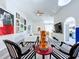 Bright living room with modern decor, geometric rug, and arched doorways at 6314 Gondola Dr, Riverview, FL 33578
