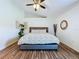 Relaxing main bedroom showcasing vaulted ceilings, ceiling fan, and modern décor at 6314 Gondola Dr, Riverview, FL 33578