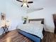 Inviting main bedroom featuring vaulted ceilings, wood-look floors, and tasteful decorations at 6314 Gondola Dr, Riverview, FL 33578
