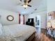 Cozy main bedroom with wood-look floors, an en-suite bath, and a serene ambiance at 6314 Gondola Dr, Riverview, FL 33578