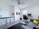 Home office features a desk, sofa, and mounted television, offering a versatile workspace at 6314 Gondola Dr, Riverview, FL 33578