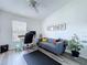 Cozy home office with a comfortable sofa, desk, and natural light at 6314 Gondola Dr, Riverview, FL 33578