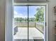 View of a fenced patio with a lake view through sliding glass doors at 6314 Gondola Dr, Riverview, FL 33578