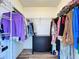 Well-organized walk-in closet with shelving, hanging rods, and a dresser for storage at 6314 Gondola Dr, Riverview, FL 33578