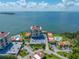 Stunning aerial view showcasing the waterfront property, pool, and surrounding landscape at 6372 Palma Del Mar S Blvd # 601, St Petersburg, FL 33715