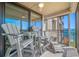 Relaxing outdoor balcony featuring stylish seating, perfect for enjoying scenic views at 6372 Palma Del Mar S Blvd # 601, St Petersburg, FL 33715
