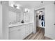 Bright bathroom with a double sink vanity and closet storage offers organized and stylish spaces at 6372 Palma Del Mar S Blvd # 601, St Petersburg, FL 33715