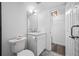 This bright bathroom features a white vanity, tiled floor, and well-lit mirror, creating a clean and inviting space at 6372 Palma Del Mar S Blvd # 601, St Petersburg, FL 33715